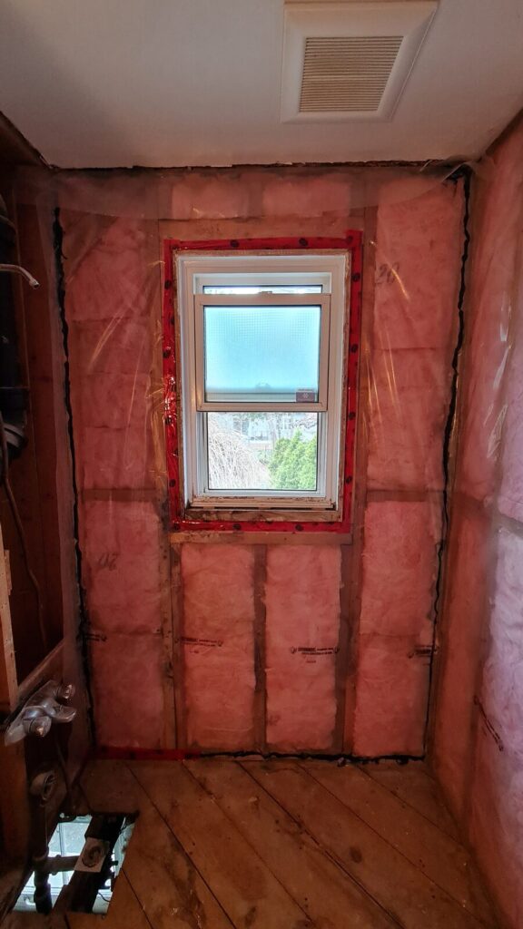 Upgraded wall insulation with a new vapour barrier before drywall